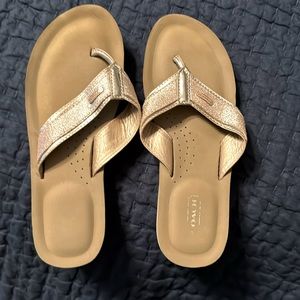 Coach flip flops gold